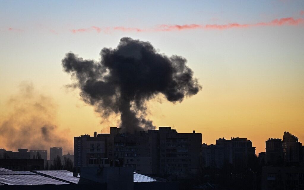 This photograph taken on March 16, 2022 shows smoke rising after an explosion in Kyiv (Aris Messinis / AFP)