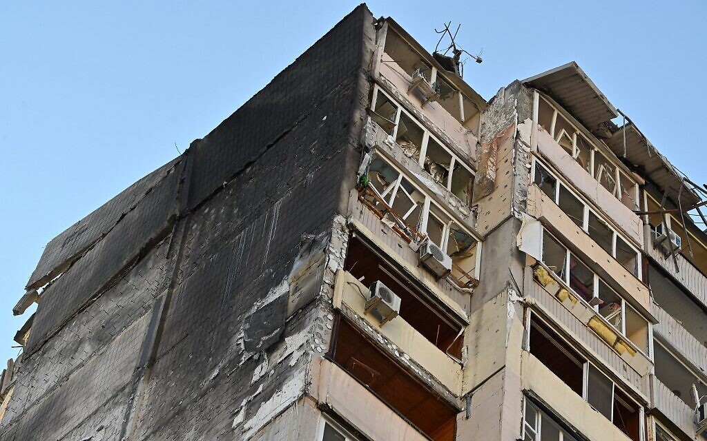 A damaged apartment building that was hit by debris from a downed rocket in Kyiv on March 17, 2022, as Russian forces press in on the Ukrainian capital. (Genya Savilov/AFP)