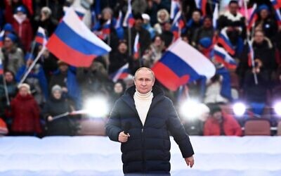 Russian President Vladimir Putin attends a concert marking the eighth anniversary of Russia's annexation of Crimea at the Luzhniki stadium in Moscow on March 18, 2022. (Sergei GUNEYEV / POOL / AFP)