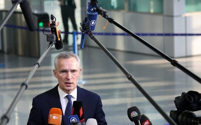 NATO Secretary General Jens Stoltenberg addresses media representatives as he arrives ahead of an extraordinary NATO summit at NATO Headquarters in Brussels on March 24, 2022. (Kenzo TRIBOUILLARD / AFP)