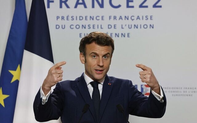 France's President Emmanuel Macron gestures as he talks to the press on the second day of a European Union summit at the EU Headquarters in Brussels, on March 25, 2022. (Ludovic Marin/AFP)
