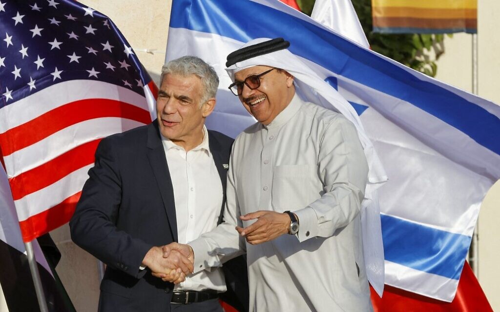 Foreign Minister Yair Lapid (L) welcomes his Bahraini counterpart Abdullatif bin Rashid al-Zayani at Sde Boker in southern Israel on March 27, 2022, ahead of the Negev Summit. (Jack Guez/AFP)