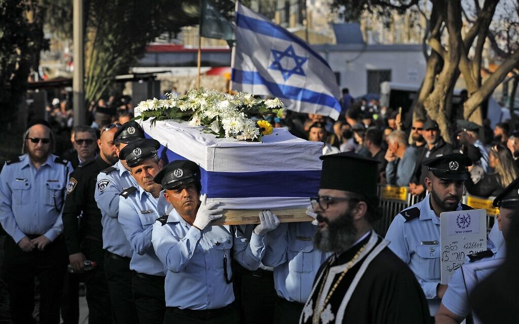 Israeli police officers carry the coffin of police officer Amir Khoury, who was killed in a terrorist shooting attack in Bnei Brak, during his funeral in Nazareth, on March 31, 2022. (Jalaa Marey/AFP)