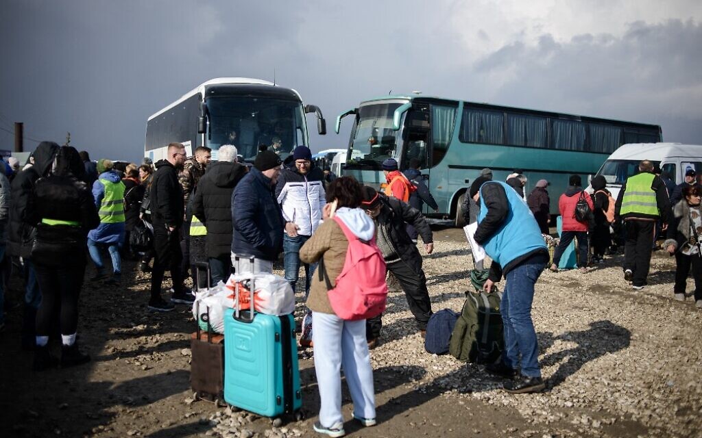 Refugees are waiting for buses to leave for Chisinau or other places, in the temporary train station near Palanca customs, Palanca, Moldova, March 8th, 2022. (Dan Gutu/European Union/AFP)