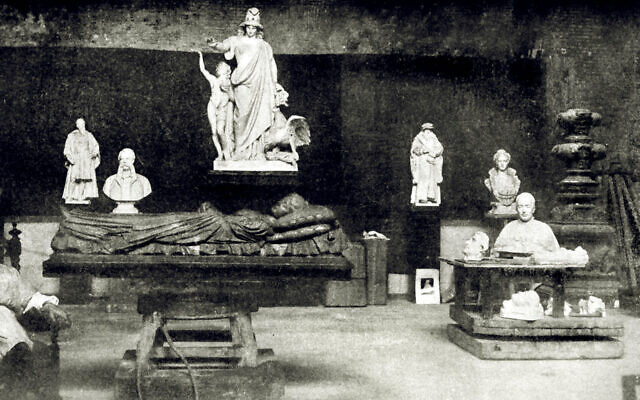 Jewish sculptor Moses David Ezekiel (left) in his Rome studio with his statue 'Religious Liberty' (back center), 1909. A planned Princeton University exhibit of Jewish American artists in 2022 was to feature Ezekiel and a statue based on 'Religious Liberty,' but was scrapped owing to his lifelong support of the Confederacy. (Public domain via JTA)