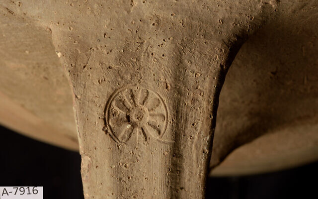 A 6th century BCE jar handle with a rosette impression associated with the royal economy in the Kingdom of Judah. (Eliyahu Yanai/City of David)