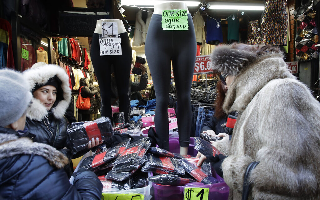 In this December 16, 2016 photo, women choose stockings for sale in a Brighton Beach clothing store in the Brooklyn borough of New York. (AP Photo/Mark Lennihan)