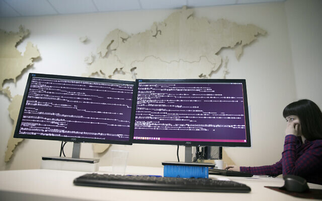A computer code is seen on displays in the office of Global Cyber Security Company Group-IB in Moscow, Russia, Oct. 25, 2017. (AP/Pavel Golovkin)