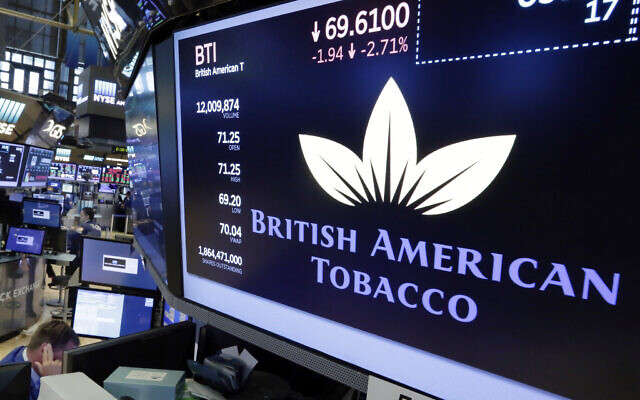 This is a Monday, July 24, 2017 file photo of the logo for British American Tobacco appears above a trading post on the floor of the New York Stock Exchange.  (AP Photo/Richard Drew/File)