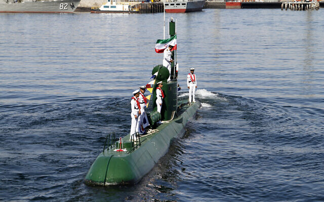 Iran's navy members stand on Ghadir-942 submarine in southern port of Bandar Abbas, Iran, at the mouth of the strategic Strait of Hormuz,  Nov. 29, 2018.  (Rahbar Emamdadi/Mehr News Agency via AP)