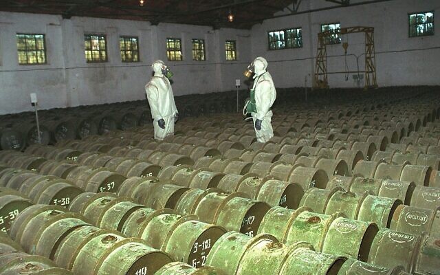 In this Saturday, May 20, 2000 file photo, two Russian soldiers make a routine check of metal containers with toxic agents at a chemical weapons storage site in the town of Gorny, 124 miles south of the Volga River city of Saratov, Russia. (AP Photo, File)