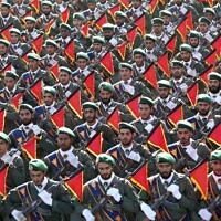 In this September 21, 2016, file photo, Iran’s Revolutionary Guard troops march in a military parade in Tehran, Iran. ​(AP Photo/Ebrahim Noroozi, File)