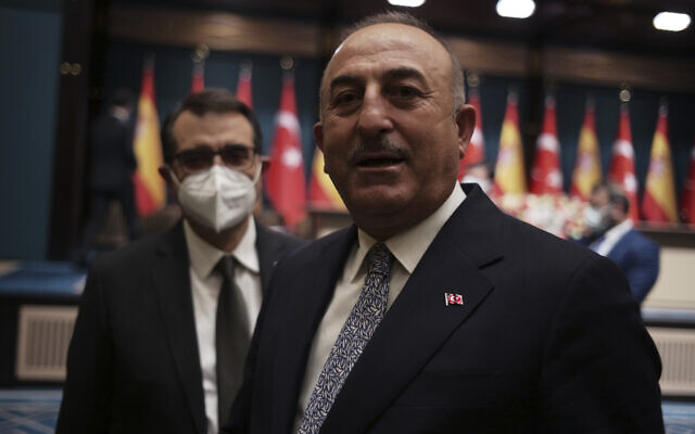 Turkey's Foreign Minister Mevlut Cavusoglu speaks to The Associated Press, at the presidential palace, in Ankara, Turkey, November 17, 2021. (AP Photo/Burhan Ozbilici)
