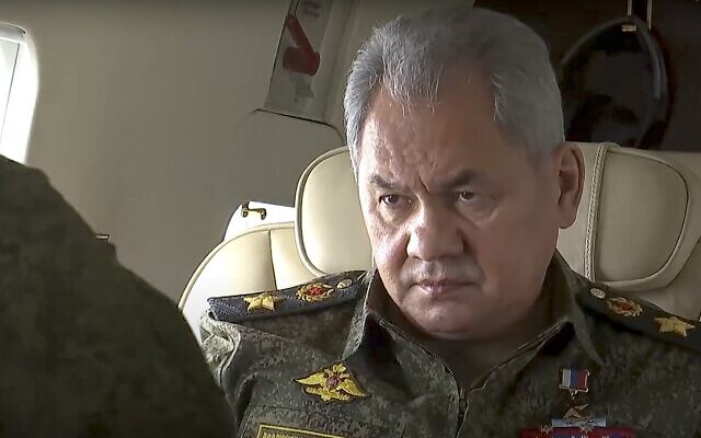 Photo taken from video provided by the Russian Defense Ministry Press Service on Feb. 16, 2022. Russian Defense Minister Sergei Shoigu speaks to officers on a military helicopter during naval exercise in the Mediterranean (Russian Defense Ministry Press Service via AP)