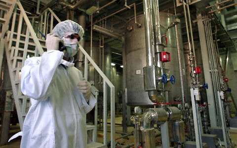 A person involved with security at the Uranium Conversion Facility just outside the city of Isfahan, Iran, on March 30, 2005. (AP Photo/Vahid Salemi, File)