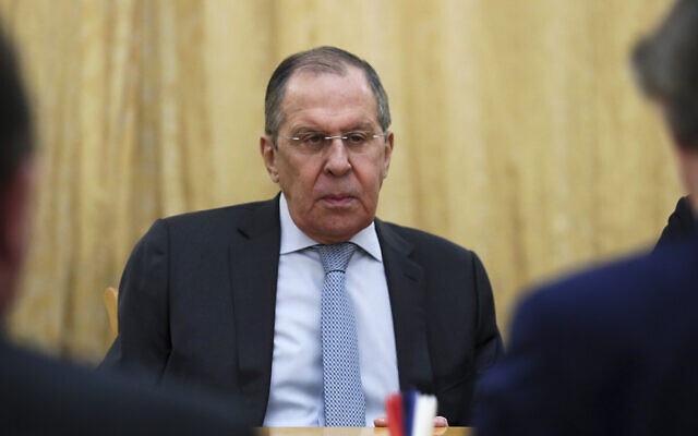 In this handout photo released by the Russian Foreign Ministry Press Service, Russian Foreign Minister Sergey Lavrov listens to the UN special envoy for Syria Geir Pedersen, right back to a camera, during their talks in Moscow, Russia, on February 23, 2022. (Russian Foreign Ministry Press Service via AP)