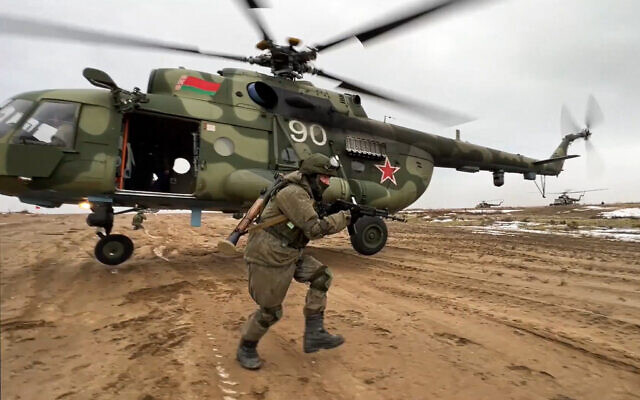 In this frame from video provided by the Russian Defense Ministry Press Service on February 19, 2022, a Russian marine runs during the Union Courage-2022 Russia-Belarus military drills at the Obuz-Lesnovsky training ground in Belarus. (Russian Defense Ministry Press Service via AP, File)
