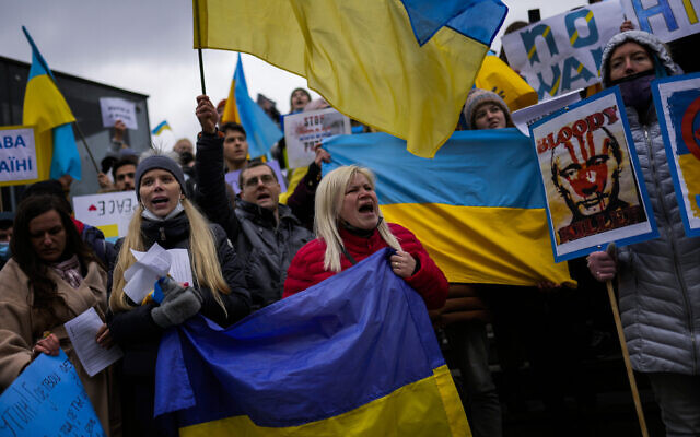 Pro-Ukrainian people wave Ukrainian flags as they shout slogans during a protest against Russia's invasion of Ukraine, in Istanbul, Turkey, on March 1, 2022. (AP Photo/Francisco Seco)
