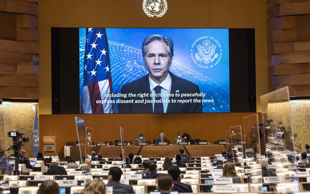 US Secretary of State, Antony Blinken, appears on a screen as he delivers a remote speech, during the 49th session of the UN Human Rights Council at the European headquarters of the United Nations in Geneva, Switzerland, March 1, 2022. (Salvatore Di Nolfi/Keystone via AP, Pool)
