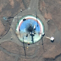In this satellite photo from Maxar Technologies, trucks and other equipment surround a scorched launch pad at Iran's Imam Khomeini Spaceport in rural Semnan province Sunday, Feb. 27, 2022. (Satellite image ©2022 Maxar Technologies via AP)