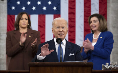 US President Joe Biden delivers his first State of the Union address to a joint session of Congress at the Capitol, flanked by Vice President Kamala Harris (left) and House Speaker Nancy Pelosi, March 1, 2022, in Washington. (Saul Loeb/Pool via AP)