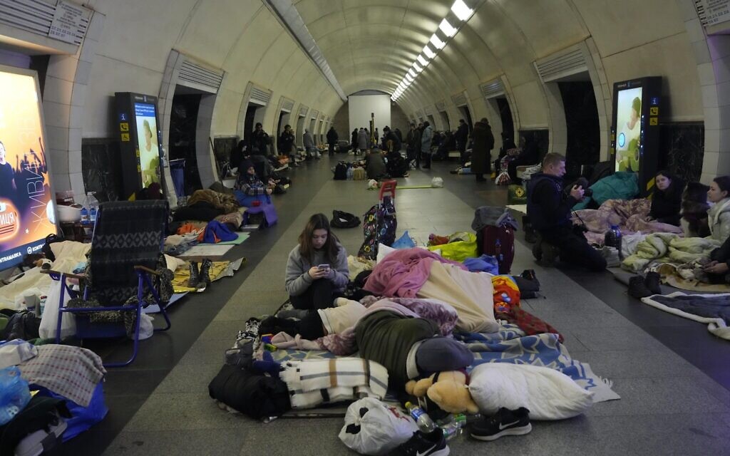 People gather in a subway, using it as a bomb shelter, in Kyiv, Ukraine, March 2, 2022. (AP Photo/Efrem Lukatsky)
