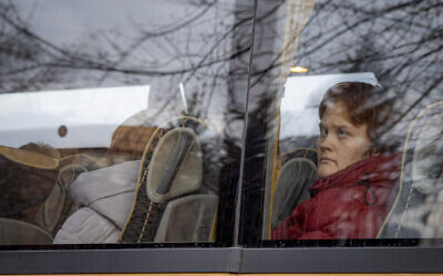 At the train station in the Hungarian town of Zahony, more than 200 Ukrainians with disabilities — residents of two care homes in Ukraine's capital of Kyiv — disembarked into the cold wind of the train platform after an arduous escape from the violence gripping Ukraine, March 2, 2022. (AP Photo/Balazs Kaufmann)