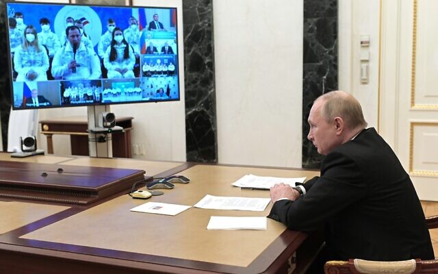 Russian President Vladimir Putin talks via videoconference with members of the Russian Paralympic Committee team ahead of the XIII Paralympic Winter Games in Beijing, in Moscow, Russia, Feb. 21, 2022. (Alexei Nikolsky, Sputnik, Kremlin Pool Photo via AP)