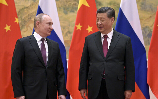 Chinese President Xi Jinping, right, and Russian President Vladimir Putin talk to each other during their meeting in Beijing, on February 4, 2022. (Alexei Druzhinin, Sputnik, Kremlin Pool Photo via AP, File)