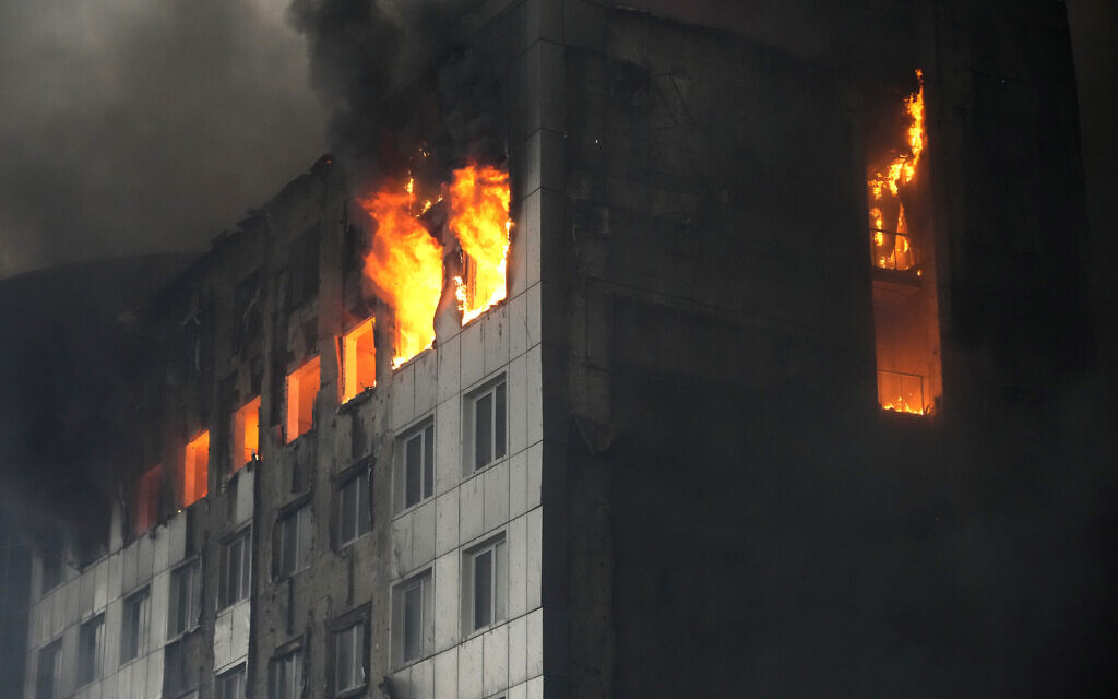 A building is engulfed in flames after shelling in Kyiv, Ukraine, March 3, 2022.  (AP Photo/Efrem Lukatsky)
