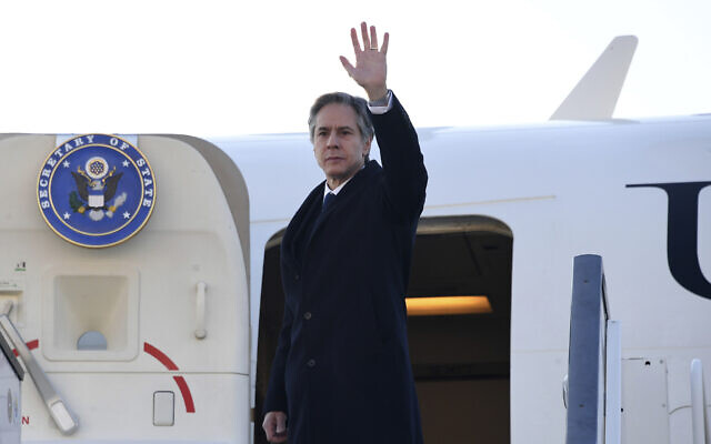 US Secretary of State Antony Blinken waves as he boards a military aircraft in Brussels, March 5, 2022 (Olivier Douliery, Pool Photo via AP)