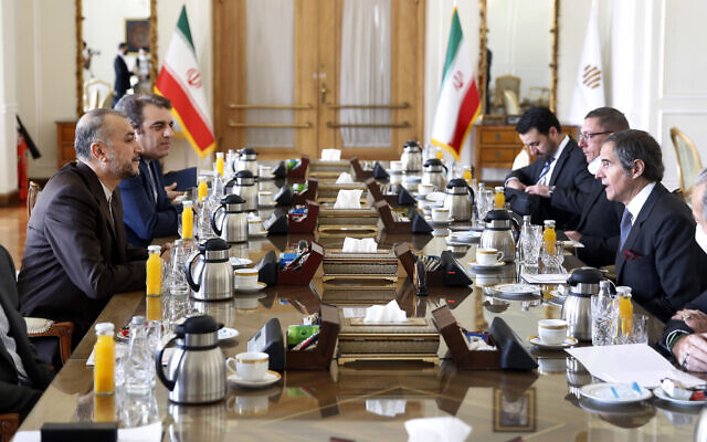 International Atomic Energy Organization, IAEA, Director General Rafael Mariano Grossi, right, speaks with with Iran’s Foreign Minister Hossein Amirabdollahian, left, during their meeting in Tehran, March 5, 2022. (AP Photo)