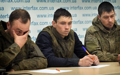 Captured Russian soldiers answer media questions at a press conference in the Interfax news agency in Kyiv, Ukraine, March 5, 2022. (AP Photo/Efrem Lukatsky)