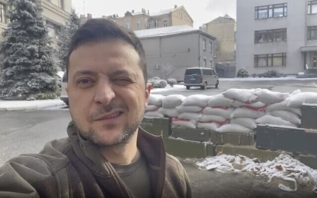 In this March 8, 2022, image from video provided by the Ukrainian Presidential Press Office and posted on Instagram, Ukrainian President Volodymyr Zelenskyy winks as he speaks in Kyiv, Ukraine. (Ukrainian Presidential Press Office via AP)