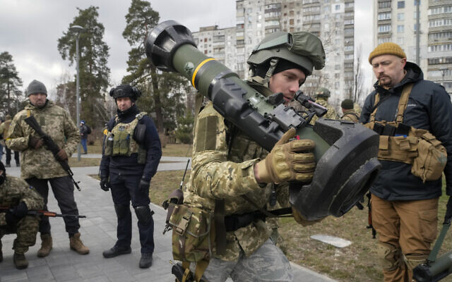 A Ukrainian Territorial Defence Forces member holds an NLAW anti-tank weapon, in the outskirts of Kyiv, Ukraine, on Wednesday, March 9, 2022. (AP/Efrem Lukatsky)