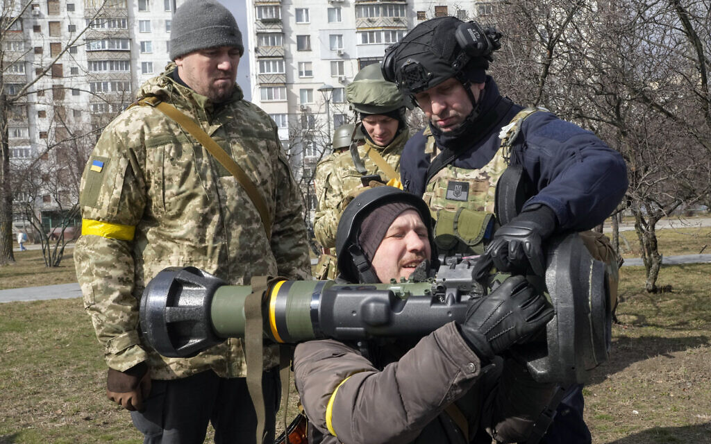 Ukrainian Territorial Defence Forces members train to use an NLAW anti-tank weapon in Kyiv outskirts, Ukraine, on Wednesday, March 9, 2022. (AP Photo/Efrem Lukatsky)