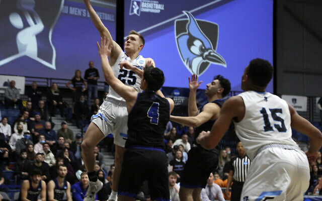 Johns Hopkins University's Lincoln Yeutter (25) reaches for a layup in the first round of the NCAA's Division III basketball tournament against Yeshiva University, in Galloway Township, N.J., on Friday, March 4, 2022. (AP Photo/Jessie Wardarski)