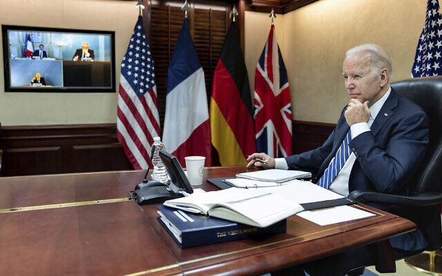 In this image provided by the White House, US President Joe Biden listens during a secure video call with French President Emmanuel Macron, German Chancellor Olaf Scholz and British Prime Minister Boris Johnson in the Situation Room at the White House, March 7, 2022, in Washington. (Adam Schultz/The White House via AP, File)