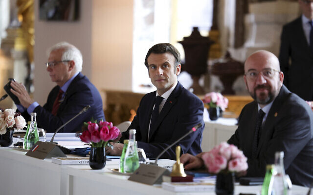 President of the European Council Charles Michel, right, French President Emmanuel Macron, center, and High Representative of the European Union for Foreign Affairs and Security Policy Josep Borrell attend an informal summit of EU leaders at the Chateau de Versailles in Versailles, west of Paris, March 11, 2022. (Sarah Meyssonnier/Pool via AP)