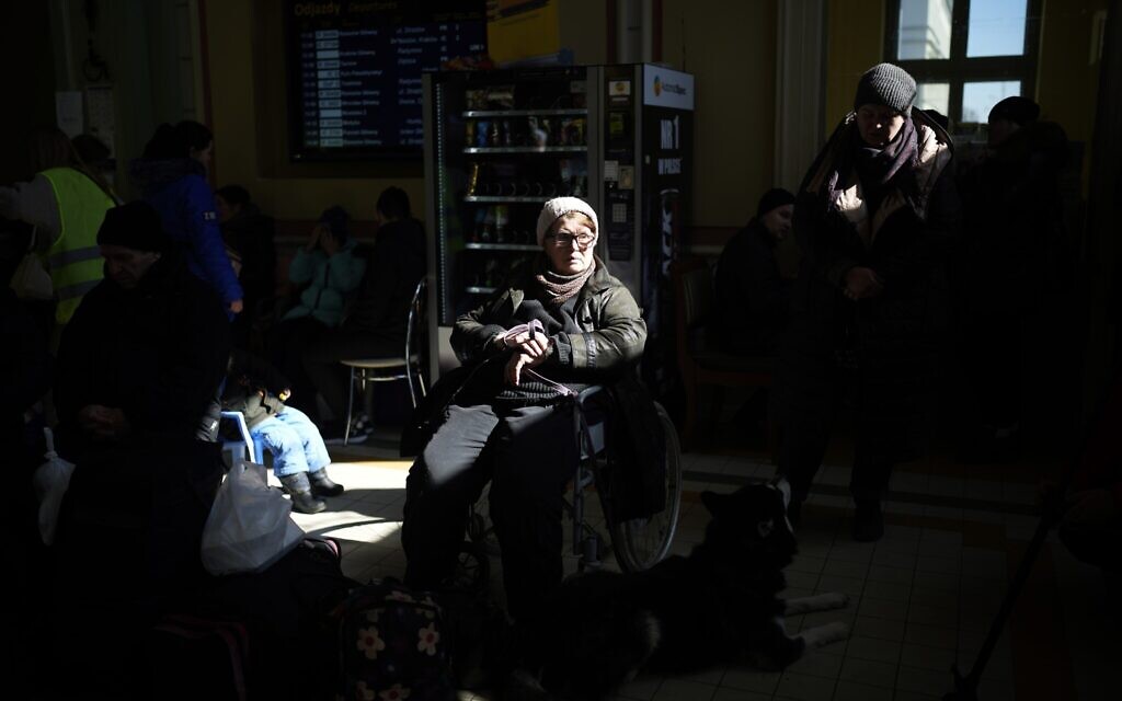 Ukrainian refugees wait at Przemysl train station, southeastern Poland, March 11, 2022. (AP Photo/Daniel Cole)