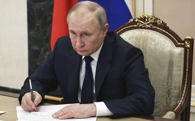 Russian President Vladimir Putin chairs a meeting with members of the government via teleconference in Moscow, March 10, 2022. (Mikhail Klimentyev, Sputnik, Kremlin Pool Photo via AP, File)