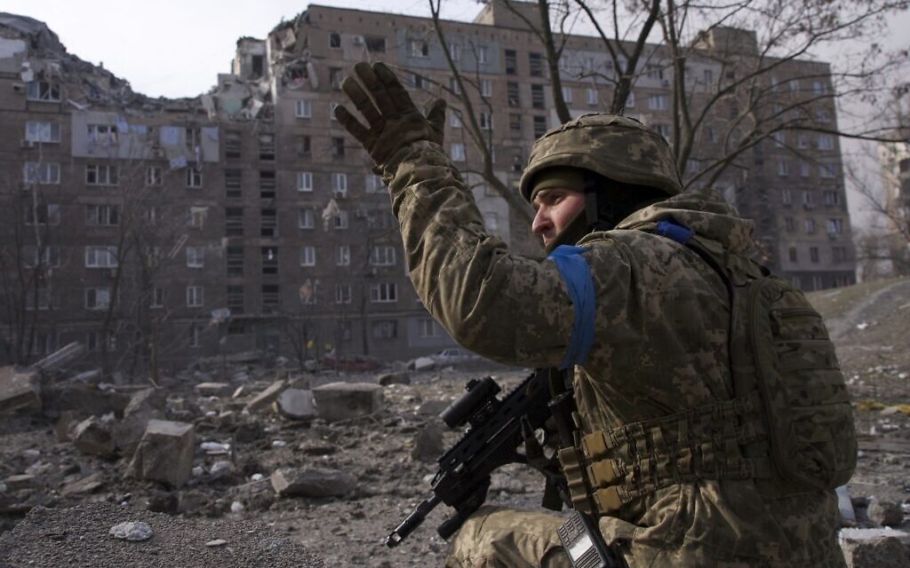A Ukrainian serviceman guards his position in Mariupol, Ukraine, March 12, 2022. (AP Photo/Mstyslav Chernov)