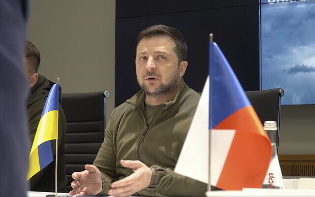 In this image from video provided by the Ukrainian Presidential Press Office, Ukrainian President Volodymyr Zelensky speaks during a meeting with Slovenia Prime Minister Janez Jansa, Czech Republic Prime Minister Petr Fiala, Polish Prime Minister Mateusz Morawiecki and Polish Deputy Prime Minister Jaroslaw Kaczynski on behalf of the European Council, in Kyiv, Ukraine, on Tuesday, March 15, 2022. (Ukrainian Presidential Press Office via AP)