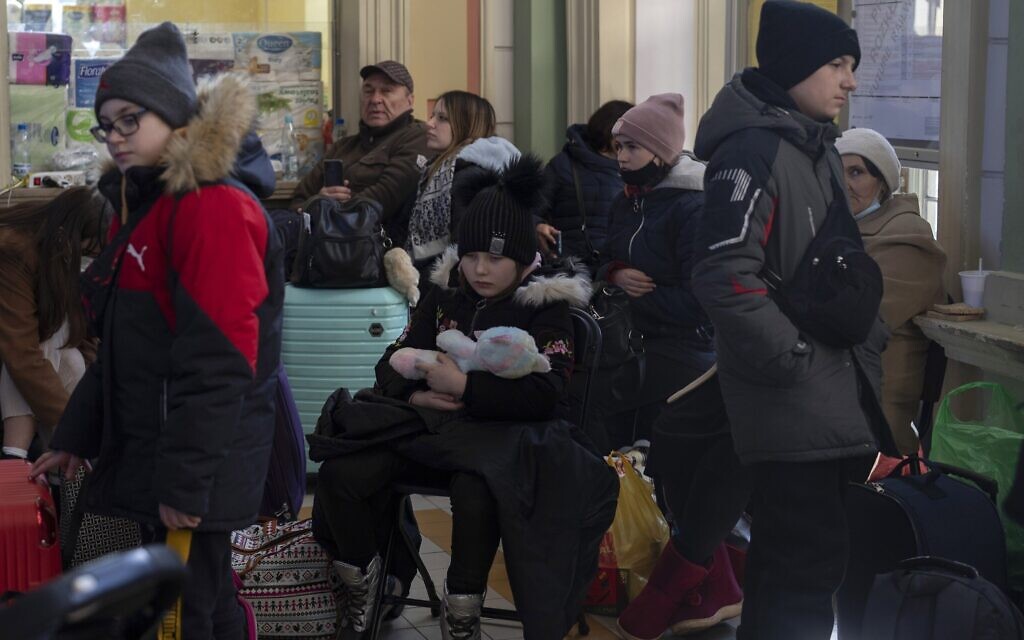 People who fled the war in Ukraine wait at the train station in Przemysl, southeastern Poland, March 17, 2022. (AP Photo/Petros Giannakouris)