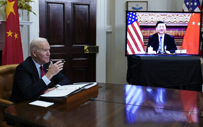 US President Joe Biden meets virtually with Chinese President Xi Jinping from the Roosevelt Room of the White House in Washington, on Nov. 15, 2021.  (AP Photo/Susan Walsh, File)