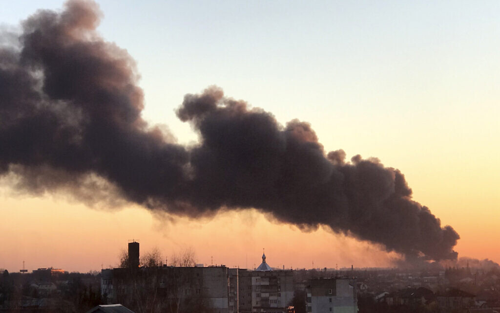 A cloud of smoke raises after an explosion in Lviv, western Ukraine, March 18, 2022 (AP Photo)