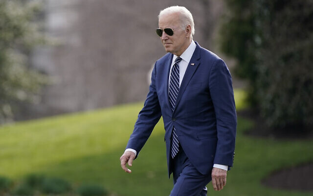 President Joe Biden walks on the South Lawn of the White House before boarding Marine One, March 18, 2022, in Washington. Biden is spending the weekend at his home in Rehoboth Beach, Del. (AP Photo/Patrick Semansky)