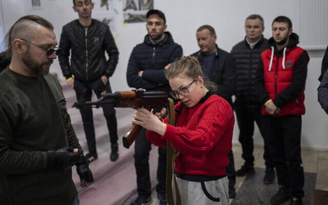 Ukrainian civilians receive weapons training in Lviv, Western Ukraine, Saturday, March 19, 2022. Fighting raged on multiple fronts in Ukraine more than three weeks after Russia’s Feb. 24 invasion. U.N. bodies have confirmed more than 800 civilian deaths since the war began but say the real toll is considerably higher. The U.N. says more than 3.3 million people have fled Ukraine as refugees. (AP Photo/Bernat Armangue)