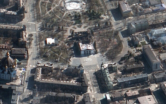 This satellite image provided by Maxar Technologies on March 19, 2022, shows the aftermath of the airstrike on the Mariupol Drama theater, Ukraine, and the area around it. (Satellite image ©2022 Maxar Technologies via AP)