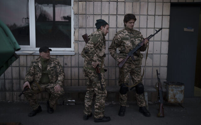 Civilian volunteers attend a training camp of the Ukrainian Territorial Defense Forces in Brovary, northeast of Kyiv, Ukraine, Monday, March 21, 2022. (AP Photo/Felipe Dana)